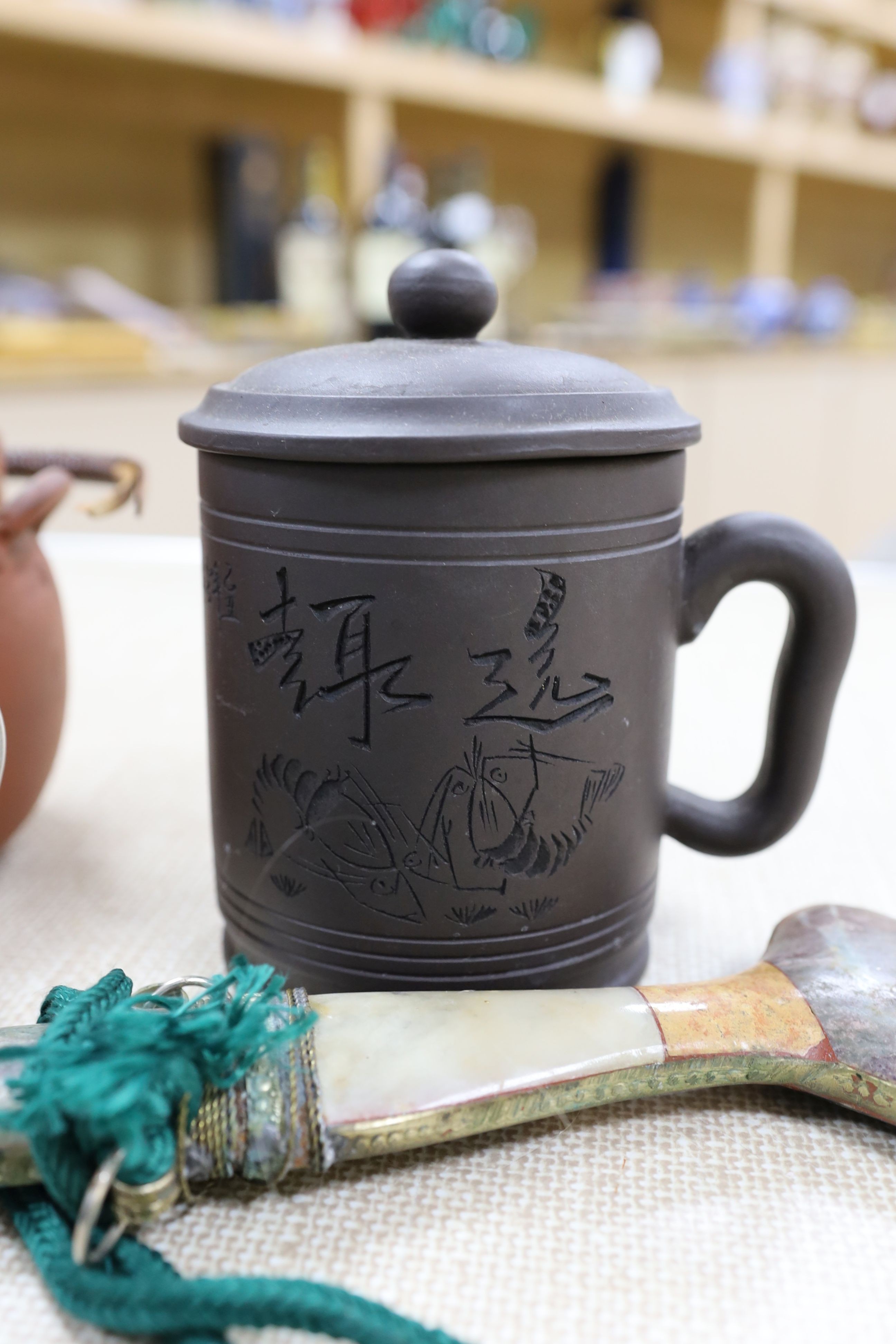 A group of Japanese Satsuma pottery, a Japanese red stoneware teapot, a Chinese Yixing jar and cover, a Middle Eastern dagger and a blue glass rolling pin